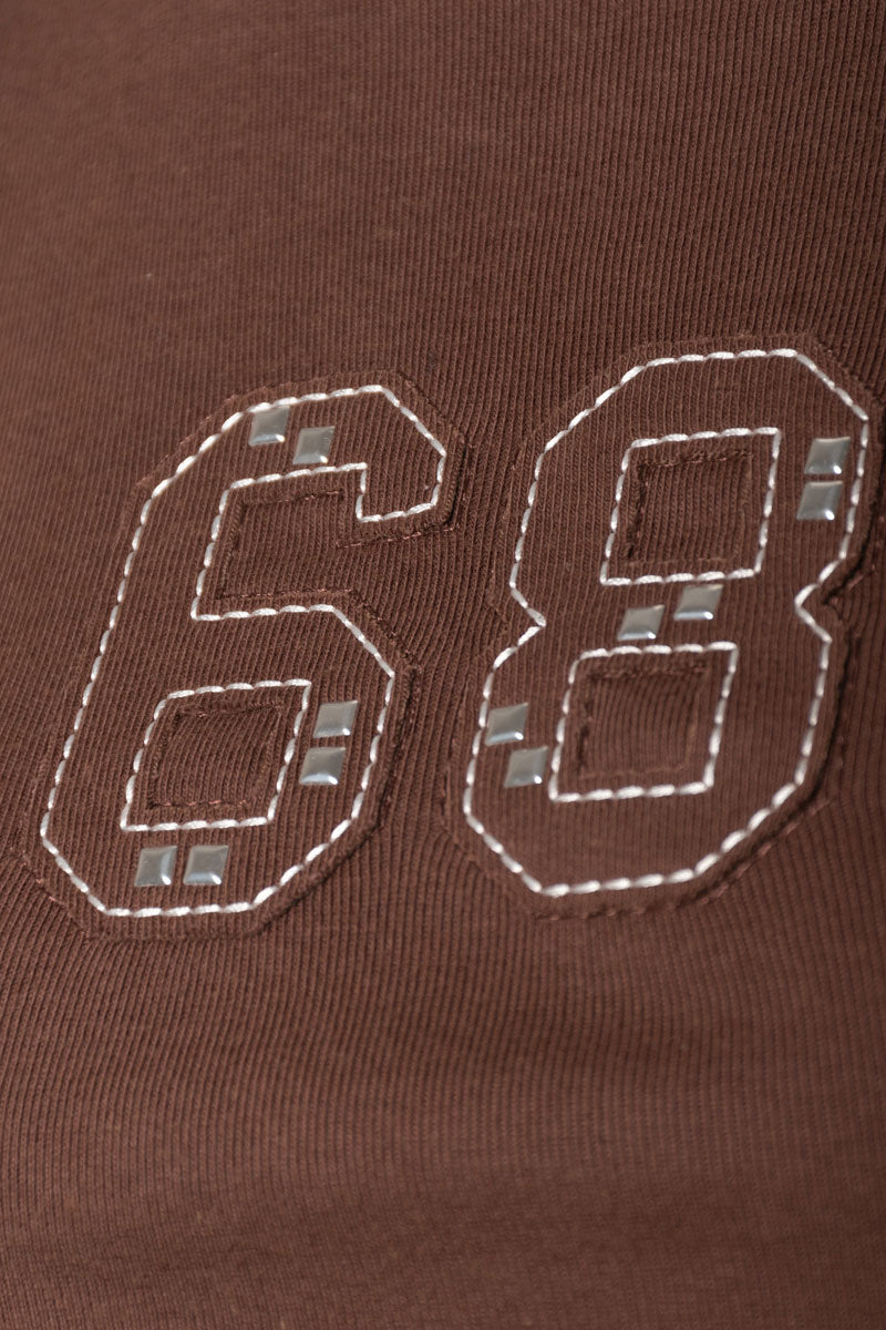 Remera PROWL - detalle de tachas